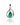 A silver teardrop pendant featuring a central green emerald-cut gemstone and pavé-set clear stones along the curved sides, shown on a white background with a soft reflection below.